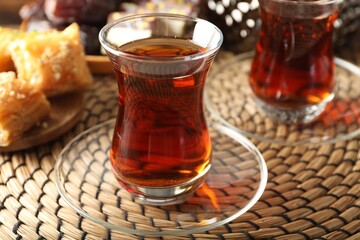 Tasty Turkish tea served on table, closeup