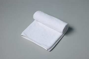 One clean terry towel on gray background