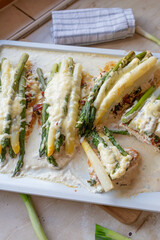 Baked chicken breast with white and green asparagus with a delicious cream cheese sauce 