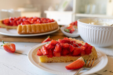 Delicious german strawberry cake on white background