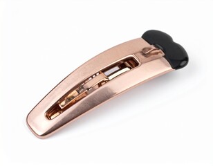 Metal hair clip in a rose gold color with black accent, flat on white background