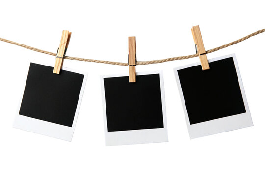A row of five Polaroid frames pinned on a rope with clothespins, showcasing simplicity and an anticipation of cherished memories, isolated on a transparent background