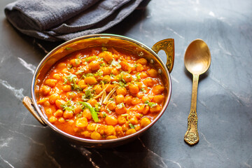 Kabuli Chana Masala is a flavorful North Indian curry made with chickpeas, tomatoes, onions, and...