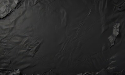 Timeworn black paper; irregular creases, rough edges, faded  ,  rough edges,  old paper,  grunge