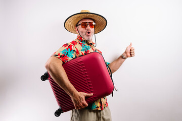 Funny tourist hugging suitcase and thumbs up