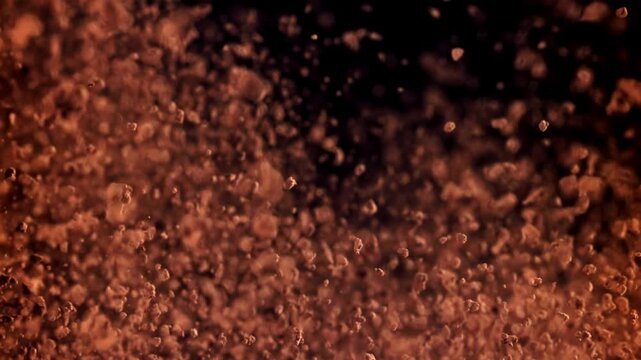 The cocoa powder flies up and down. Filmed on a high-speed camera at 1000 fps. High quality FullHD footage