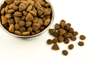Food for pets view from above on a white background. Dry food bowl