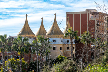 Unique building with golden cone-shaped roofs