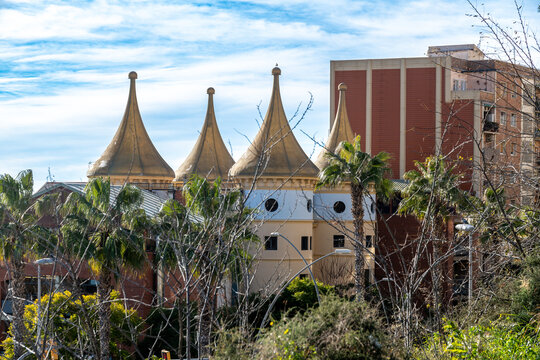 Unique building with golden cone-shaped roofs