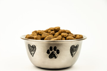 Steel plate with cat or dog food on a white background