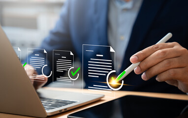 Digital document verification, Businessman using laptop and tablet to approve digital document,...