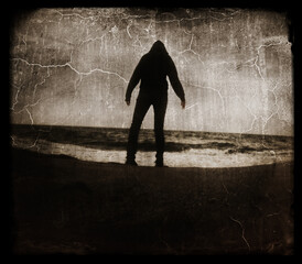 Creative image of person standing in a disaster by the water.