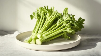 Fresh celery stalks on a plate (1)