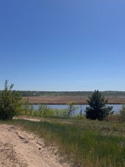 Fototapeta premium Beautiful, nature, river, spring, vibrant, fresh, flowers, green, serene, peaceful, landscape, trees, blooming, calm, clear, water, sunshine, natural, birds, bright, blossoming, gentle, blue, fresh ai