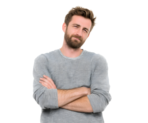 A handsome man with a beard stands with crossed arms, displaying a look of doubt or skepticism.