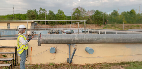 Environmental engineers work at wastewater treatment plants,Water supply engineering working at...