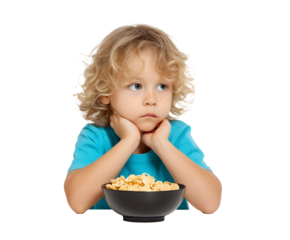 A young boy with curly blond hair sits at a table looking at a bowl of cereal while thinking.
