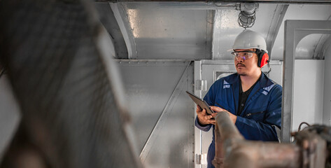 Engine engineer inspecting large machines in factory,Railway engine maintenance technician,engine repair mechanical manager