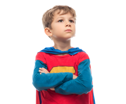 A young boy in a superhero costume gazes upward, dreaming of heroic adventures and possibilities.