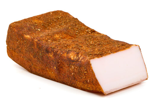 Cured pork fatback with spice crust (salo) on white background