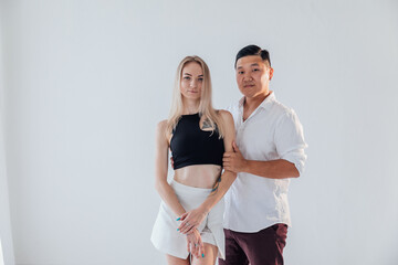Man and woman dancing together to music
