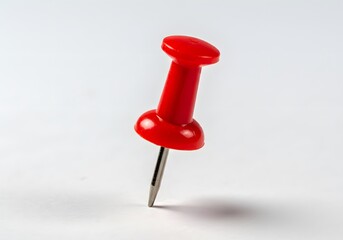 Red pushpin on white background