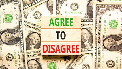 Agree to disagree symbol. Concept words Agree to disagree on beautiful wooden blocks. Dollar bills....