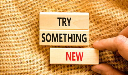 Try something new symbol. Concept words Try something new on beautiful block. Businessman's hand....