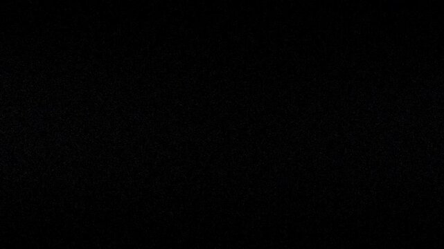 Dust overlay on black background, ideal for adding grunge and texture to design projects, photography edits, or video animations.