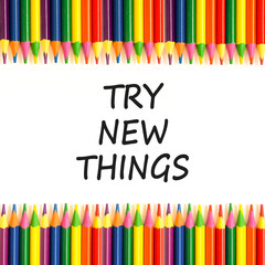 Try new things symbol. Concept words Try new things on beautiful white paper. Beautiful white paper background. Colored pencils. Business motivational lifestyle try new things concept. Copy space.