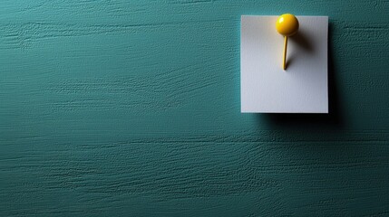 Teal wall background with small object