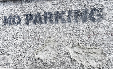 Urban textured wall with no parking sign for cityscape design and street decoration