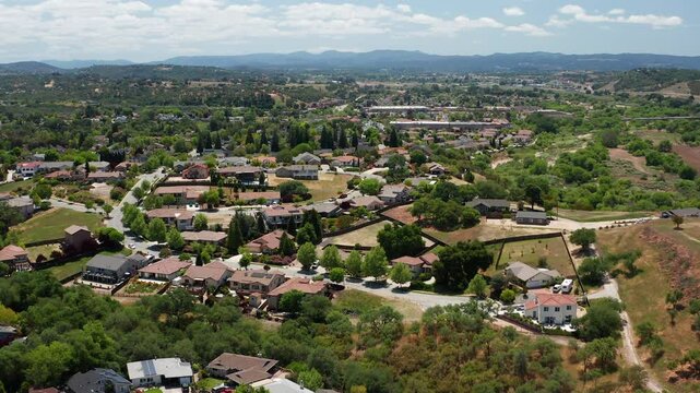 Aerial drone view of Paso Robles California suburb - homes, trees, hills 06