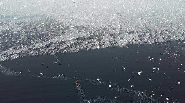 People riding on Zodiak boat in the big ocean. Endless water. Motorboat in the Southern Ocean. Antarctica. Little boat in the big Ocean. Track from the boat in the frozen ocean. 4k video