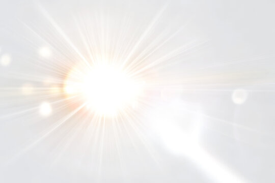 Bright sunlight burst with lens flare effects and rays of light on a white and transparent background png