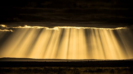 Dramatic Golden Crepuscular Rays Breaking Through Dark Clouds over Serene Landscape