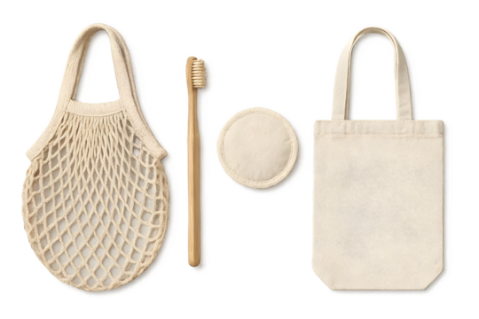 A set of eco-friendly items including a mesh bag, a bamboo toothbrush, a round cloth pad, and a small tote bag. Concept Eco-Friendly Products, Sustainable Living, Reusable Items
