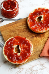 high angle view bagel with strawberry rhubarb jam