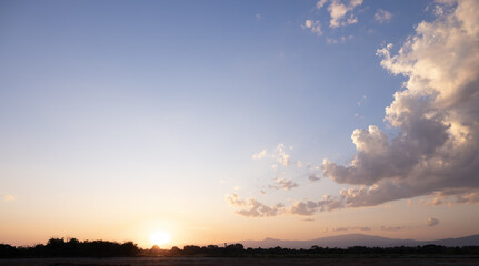 Beautiful sun sky and cloud at evening. Landscape include space, light of nature, sunset, sunrise, horizon or skyline. Colorful with yellow, orange and blue autumn for background and wallpaper.