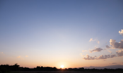Beautiful sky, sun and cloud at high. Landscape include space, light of nature, sunset, sunrise, horizon or skyline. Colorful with yellow, orange and blue color at evening time for background.