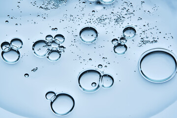 A drop of gel serum with bubbles. The texture. View from below.