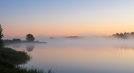 Obraz premium Tranquil Foggy Lake at Dawn