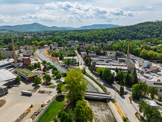Aerial drone view of Glucholazy, a city in Poland located in the Opole province. View of the rebuilt Glucholazy after the flood in spring 2025. View on the white Gluchoaska river.