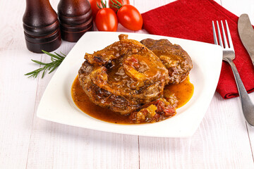 Italian cuisine - ossobuco with sauce
