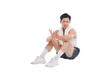 Portrait of muscular Asian man in sportswear sitting posing on white background	
