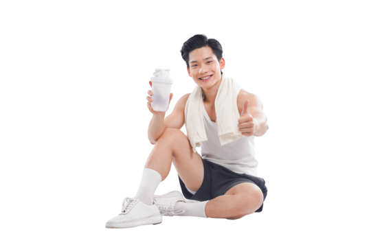 Portrait of muscular Asian man in sportswear sitting posing on white background	
