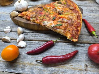 Delicious pizza lying on the table.