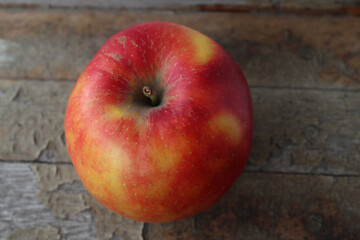 Ripe apple of the Honey Crisp variety.