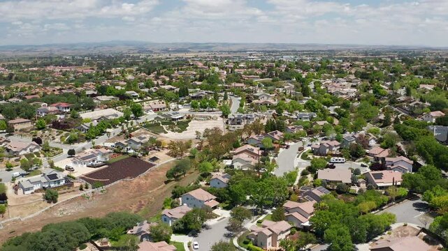 Aerial drone view of Paso Robles California suburb - homes, trees, hills 14
