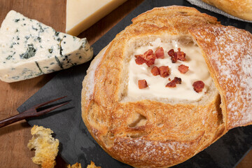 Pumpkin broth with bacon on top of Italian bread